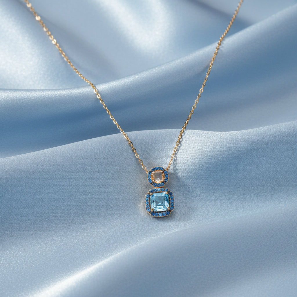 collana Ara Macao in argento 925 placcato oro giallo 18 kt e zirconi azzurri e blu