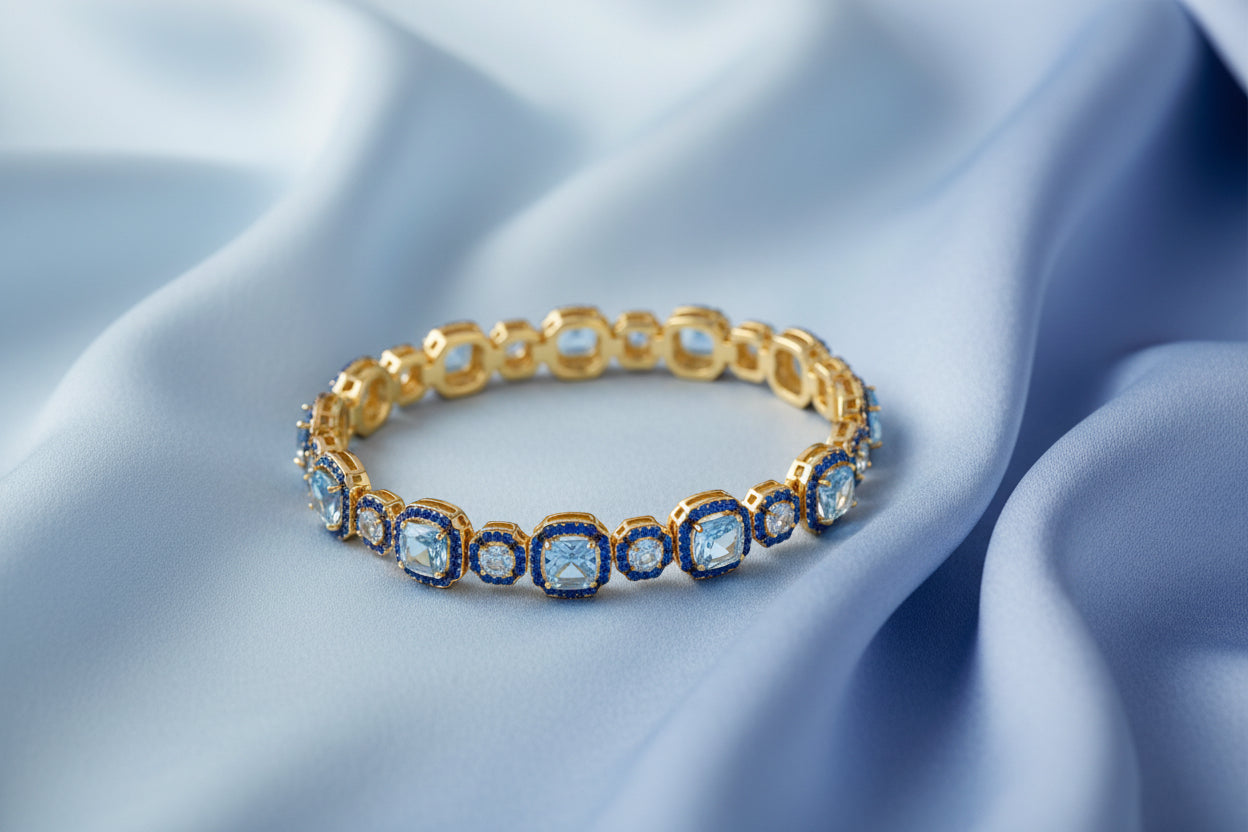 Bracciale Ara Macao in argento 925 placcato oro giallo 18 kt e zirconi azzurri e blu